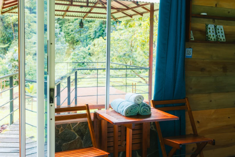 Infinity Lodge bed against the stone feature wall